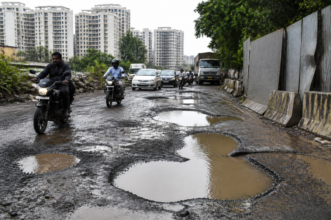 Kondhwa Budruk potholes on a damaged approach road near housing societies in Pune