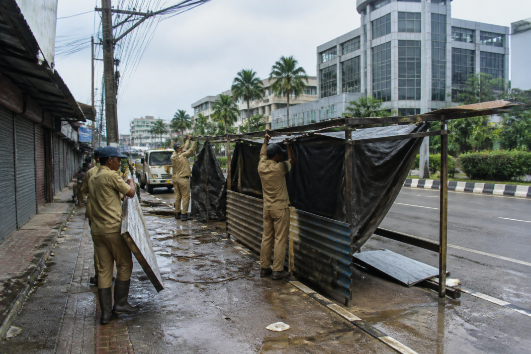 Thrikkakara illegal roadside stalls being removed during a municipal enforcement drive in Kakkanad