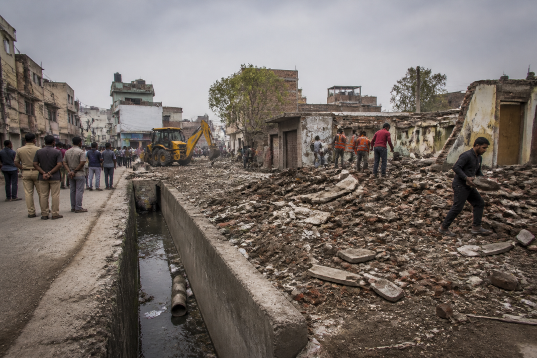 MCD encroachment removal clearing structures over a drain in Raghubir Nagar, Delhi