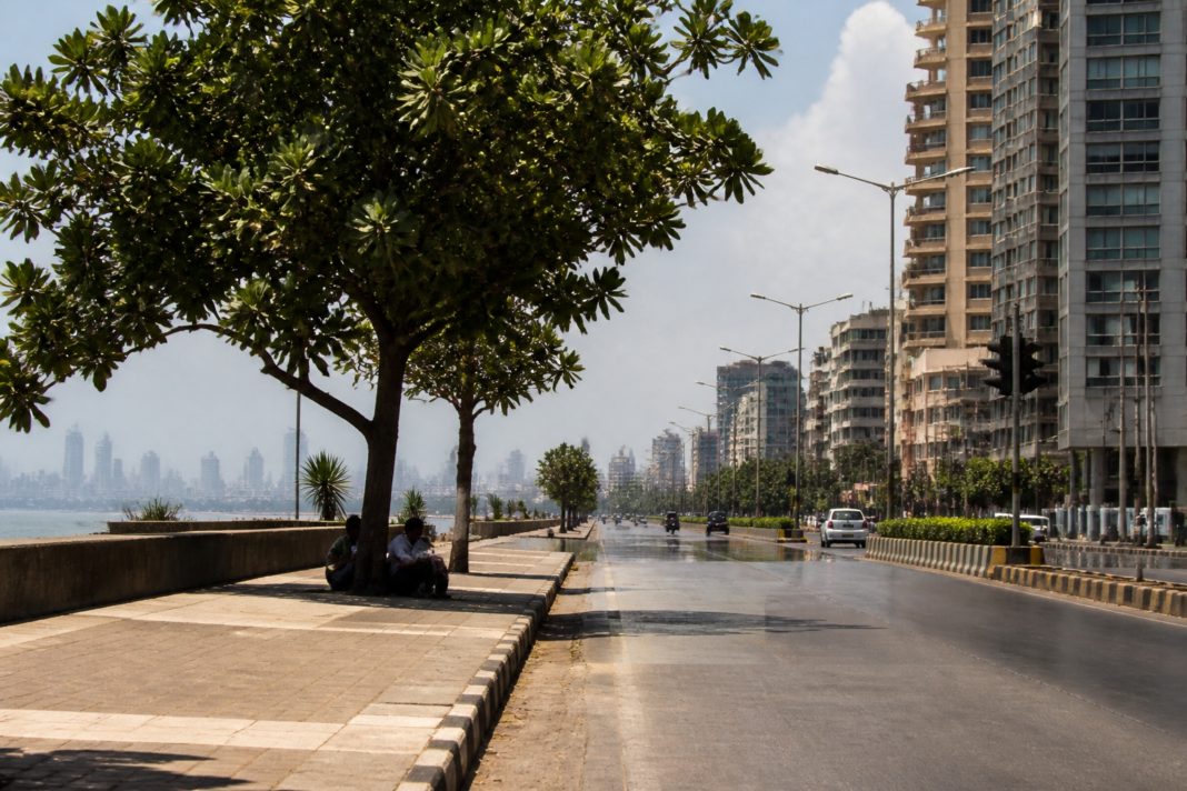 Mumbai heatwave conditions over a hot, humid city skyline with hazy skies