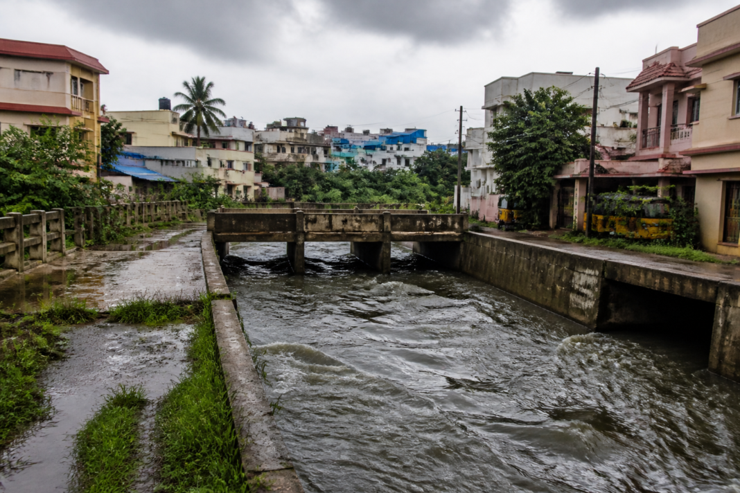 Madipakkam flooding risk near a storm-water drain and lake surplus channel in Chennai