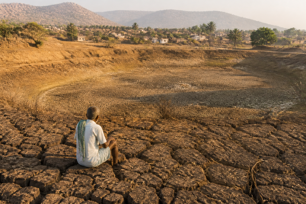 Karnataka drought-affected taluks represented by a dry rural landscape and parched farmland
