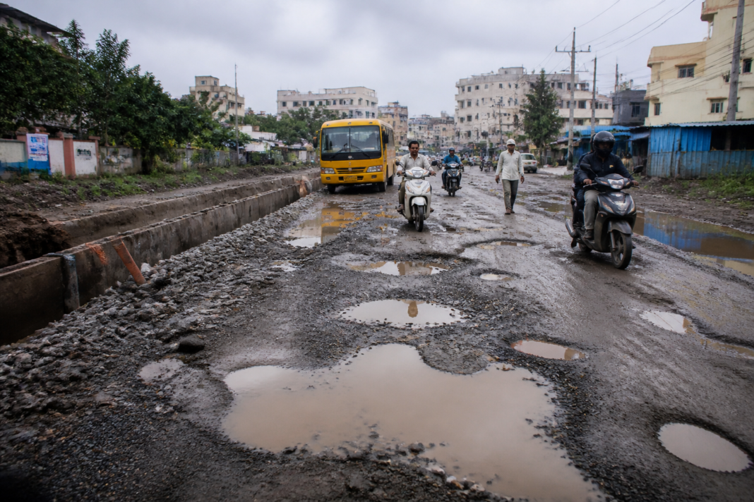 Pune road potholes and slush covering Diamond Water Park Road between Lohegaon and Wagholi