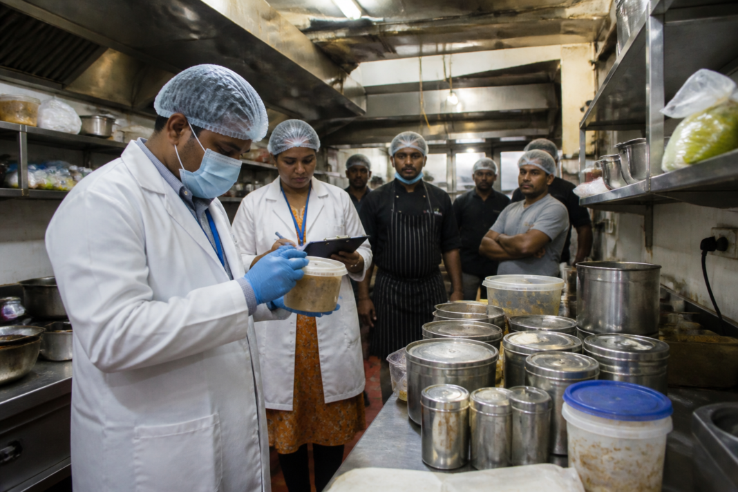 Telangana food safety officials inspecting a restaurant kitchen during an enforcement drive