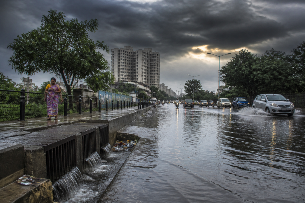 Tamil Nadu El Nino panel story illustrated by a rainwater-filled urban road and storm clouds