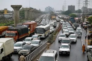 Pune-Nashik Highway Faces Kumbh Traffic Surge as Police Add Staff Pune-Nashik Highway traffic with heavy vehicles and cars near a congested junction